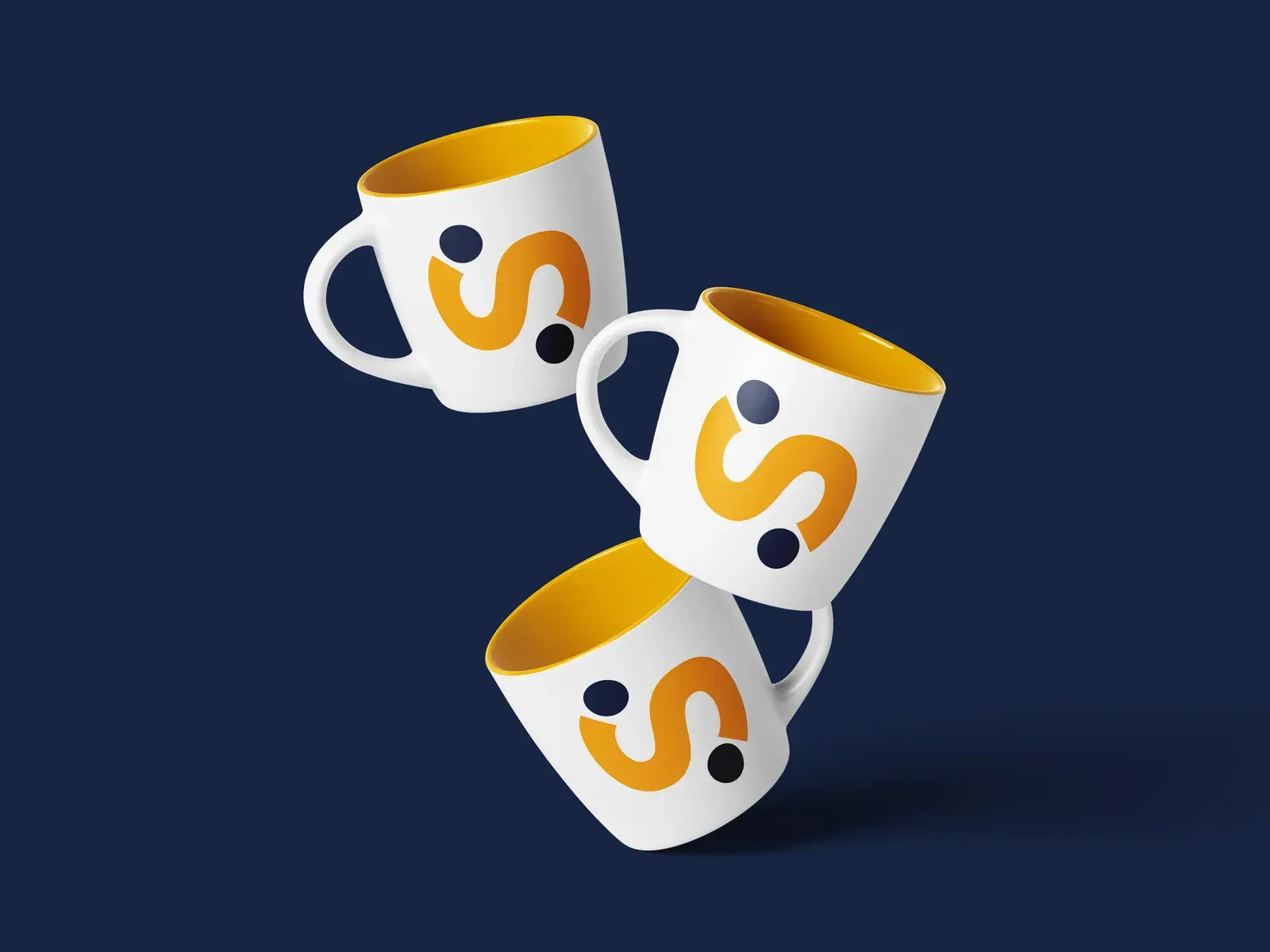 The Biz Spark branded mugs in navy, white, and gold